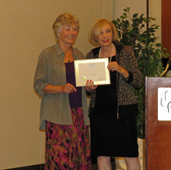 Jaimie Bruzenak receiving two awards.