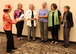 Patricia Myers conducting the installation of officers ceremony.